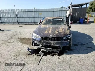 2015 BMW M4 with VIN WBS3R9C50FK335084, listed as a Copart auction lot 61962965 with 142,157 mi miles and Salvage title. Bid and sale history available at DreamBid. Image 13.