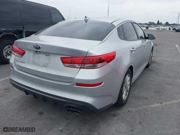 2019 Kia Optima LX with VIN 5XXGT4L3XKG285486, listed as a IAAI auction lot 41872981 with 101,981 mi miles. Bid and sale history available at carsss.com. Image 4.