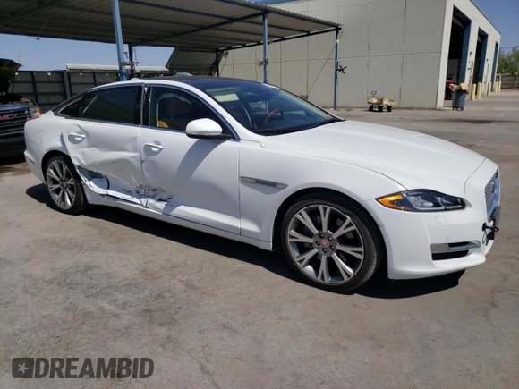 2019 Jaguar XJ Portfolio with VIN SAJWA2G72K8W21087, listed as a Copart auction lot 66017344 with 22,671 mi miles and Salvage Title. Bid and sale history available at DreamBid. Image 4.