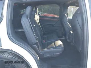2020 Tesla Model X Long Range with VIN 5YJXCDE28LF298553, listed as a IAAI auction lot 40863184 with 54,031 mi miles and . Bid and sale history available at DreamBid. Image 8.