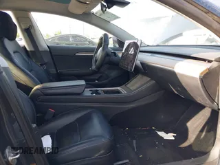 2023 Tesla Model 3 with VIN 5YJ3E1EA4PF427022, listed as a IAAI auction lot 42465964 with 169,346 mi miles and . Bid and sale history available at DreamBid. Image 5.
