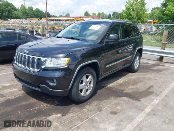 2011 Jeep Grand Cherokee Laredo with VIN 1J4RS4GG5BC534960, listed as a IAAI auction lot 42277395 with 223,690 mi miles and . Bid and sale history available at DreamBid. Image 2.