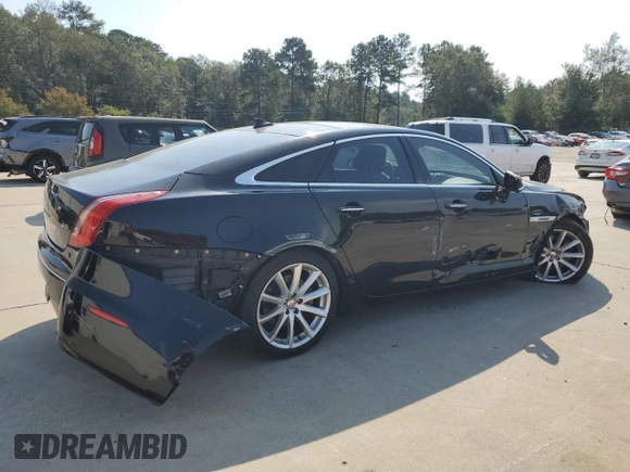2015 Jaguar XJ with VIN SAJWA1CZ7F8V83167, listed as a Copart auction lot 74991144 with 94,502 mi miles and Salvage Title. Bid and sale history available at carsss.com. Image 3.