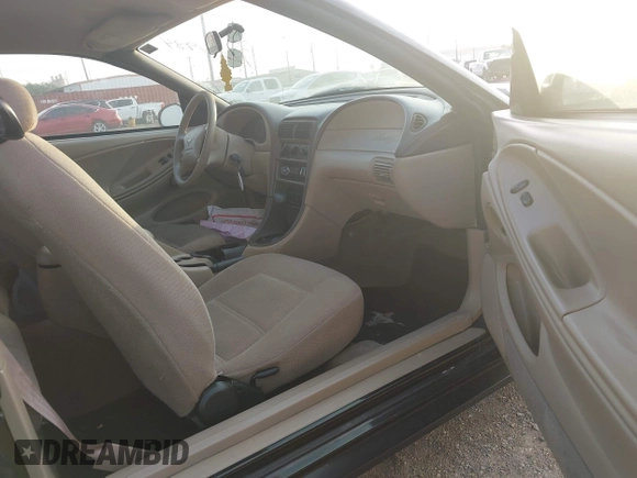 1999 Ford Mustang with VIN 1FAFP4047XF221818, listed as a IAAI auction lot 42261984 with 156,577 mi miles and . Bid and sale history available at DreamBid. Image 5.