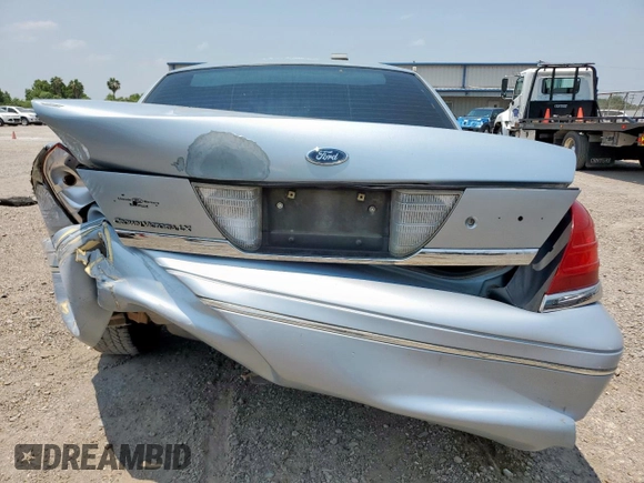 2004 Ford Crown Victoria LX z VIN 2FAFP74W54X184815, wystawiony jako Copart lot #57280725 z przebiegiem 294 513 mil mil oraz Szkoda całkowita • Salvage title. Historia ofert i sprzedaży dostępna na DreamBid. Obrazek 6.