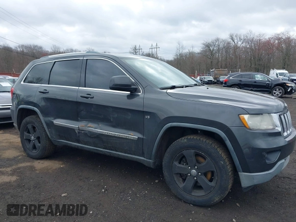2011 Jeep Grand Cherokee Laredo with VIN 1J4RR4GGXBC597743, listed as a IAAI auction lot 41897286 with 253,111 mi miles and . Bid and sale history available at DreamBid. Image 17.