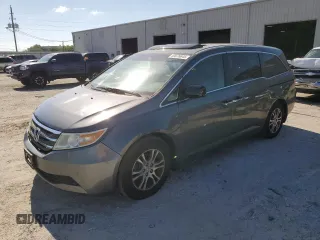 2013 Honda Odyssey EX-L with VIN 5FNRL5H61DB003677, listed as a Copart auction lot 53076645 with 168,545 mi miles and Salvage Title. Bid and sale history available at carsss.com. Image 1.