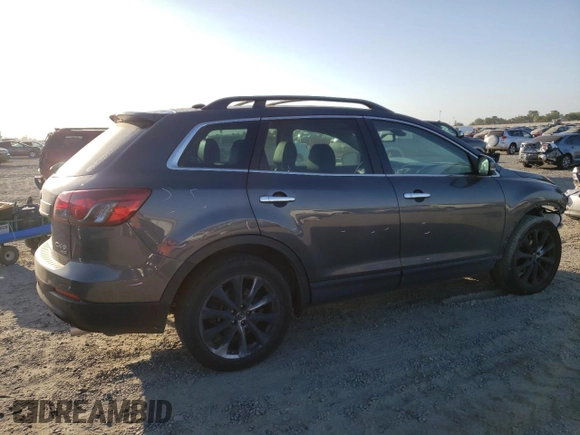 2015 Mazda CX-9 Grand Touring z VIN JM3TB3DV2F0456130, wystawiony jako Copart lot #60545095 z przebiegiem 120 892 mil mil oraz Szkoda całkowita • Salvage title. Historia ofert i sprzedaży dostępna na DreamBid. Obrazek 3.