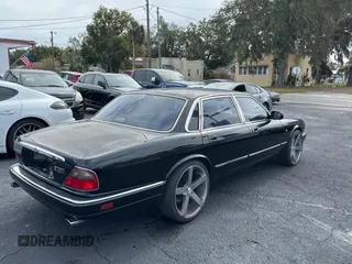 1995 Jaguar XJ with VIN SAJHX174XSC738291, listed as a Copart auction lot 87054224 with 71,076 mi miles and Clean title. Bid and sale history available at DreamBid. Image 4.