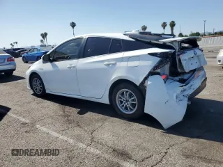 2021 Toyota Prius L Eco z VIN JTDKAMFU4M3145800, wystawiony jako Copart lot #59180285 z przebiegiem 33 991 mil mil oraz Czysty tytuł • Clean title. Historia ofert i sprzedaży dostępna na DreamBid. Obrazek 2.