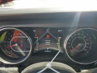 2022 Jeep Gladiator Rubicon z VIN 1C6JJTBG6NL104521, wystawiony jako Copart lot #57325365 z przebiegiem 31 498 mil mil oraz Szkoda całkowita • Salvage title. Historia ofert i sprzedaży dostępna na DreamBid. Obrazek 9.