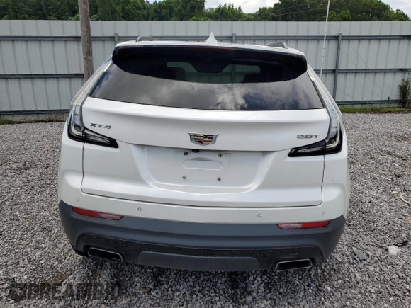 2019 Cadillac XT4 FWD Sport with VIN 1GYFZER44KF210582, listed as a Copart auction lot 61272015 with 104,073 mi miles and Salvage title. Bid and sale history available at DreamBid. Image 6.