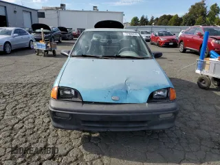 1992 Geo Metro z VIN 2C1MS2465N6782913, wystawiony jako Copart lot #77405574 z przebiegiem 77 080 mil mil oraz Szkody całkowita. Historia ofert i sprzedaży dostępna na DreamBid. Obrazek 5.