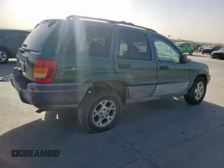 1999 Jeep Grand Cherokee Laredo with VIN 1J4G258S0XC561054, listed as a Copart auction lot 49814555 with Not provided miles and Salvage title. Bid and sale history available at DreamBid. Image 3.