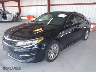 2016 Kia Optima LX with VIN 5XXGT4L33GG064125, listed as a IAAI auction lot 39506983 with 131,976 mi miles. Bid and sale history available at carsss.com. Image 2.