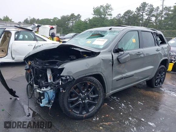 2021 Jeep Grand Cherokee Laredo X with VIN 1C4RJFAG2MC589415, listed as a IAAI auction lot 42514387 with 66,033 mi miles and . Bid and sale history available at DreamBid. Image 2.