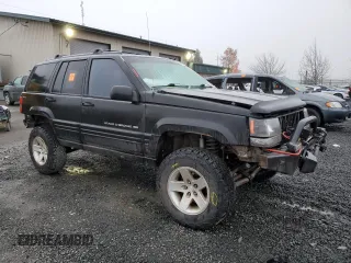 1998 Jeep Grand Cherokee Laredo with VIN 1J4GZ48S0WC171138, listed as a Copart auction lot 85502794 with 0 mi miles and Salvage Title. Bid and sale history available at carsss.com. Image 4.