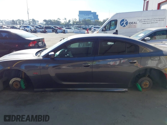2019 Dodge Charger Scat Pack with VIN 2C3CDXGJ2KH564051, listed as a IAAI auction lot 41255283 with 64,687 mi miles and . Bid and sale history available at DreamBid. Image 14.