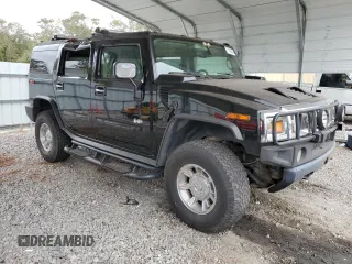 2003 Hummer H2 with VIN 5GRGN23U33H118459, listed as a Copart auction lot 77765694 with 157,390 mi miles and Salvage Title. Bid and sale history available at carsss.com. Image 4.