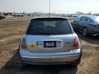 2004 MINI Hardtop with VIN WMWRC33454TJ56308, listed as a Copart auction lot 59690865 with 99,374 mi miles and Salvage title. Bid and sale history available at DreamBid. Image 6.