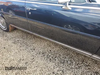 1989 Cadillac Brougham z VIN 1G6DW51Y6KR723841, wystawiony jako Copart lot #74548864 z przebiegiem 74 705 mil mil oraz Szkody całkowita. Historia ofert i sprzedaży dostępna na DreamBid. Obrazek 12.
