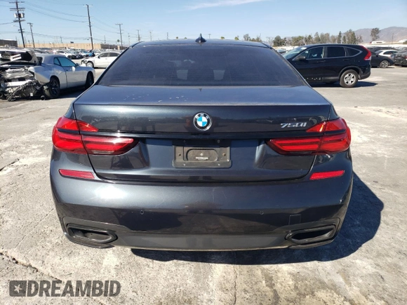 2019 BMW 7 Series 750i with VIN WBA7F0C56KGM25430, listed as a Copart auction lot 42048135 with 74,717 mi miles and Salvage title. Bid and sale history available at DreamBid. Image 6.