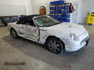 2002 Ford Thunderbird Hardtop Premium with VIN 1FAHP60A32Y125580, listed as a Copart auction lot 77493514 with 74,619 mi miles and Salvage Title. Bid and sale history available at DreamBid. Image 4.