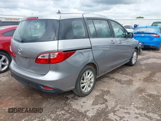 2012 Mazda 5 Sport with VIN JM1CW2BL0C0111151, listed as a IAAI auction lot 42359887 with 158,986 mi miles and . Bid and sale history available at DreamBid. Image 4.