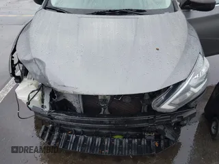2018 Nissan Sentra S with VIN 3N1AB7AP0JY244535, listed as a IAAI auction lot 41573436 with 150,919 mi miles and . Bid and sale history available at DreamBid. Image 6.