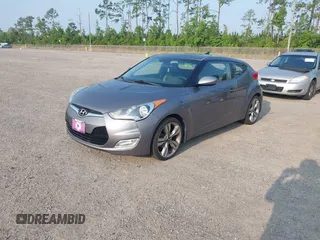 2012 Hyundai Veloster w/Gray Int z VIN KMHTC6AD1CU081754, wystawiony jako IAAI lot #42421889 z przebiegiem 99 593 mil mil oraz . Historia ofert i sprzedaży dostępna na DreamBid. Obrazek 2.