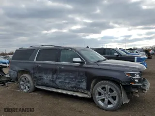 2017 Chevrolet Suburban Premier with VIN 1GNSKJKCXHR403076, listed as a Copart auction lot 46606025 with 99,481 mi miles and Salvage Title. Bid and sale history available at carsss.com. Image 4.