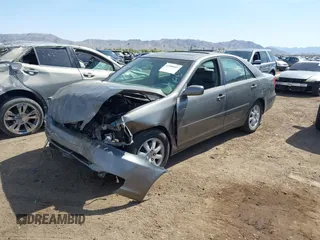 2004 Toyota Camry LE with VIN 4T1BF30K24U569209, listed as a IAAI auction lot 41988665 with 191,017 mi miles. Bid and sale history available at carsss.com. Image 2.