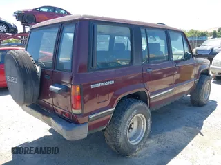 1991 Isuzu Trooper z VIN JACCH58R8M7904079, wystawiony jako IAAI lot #42303036 z przebiegiem 244 672 mil mil oraz . Historia ofert i sprzedaży dostępna na DreamBid. Obrazek 4.