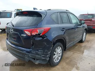 2015 Mazda CX-5 Touring with VIN JM3KE2CY5F0449195, listed as a IAAI auction lot 41894567 with 124,694 mi miles and . Bid and sale history available at DreamBid. Image 4.