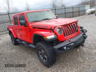 2020 Jeep Gladiator Rubicon z VIN 1C6JJTBG1LL168379, wystawiony jako IAAI lot #41834252 z przebiegiem 88 819 mil mil oraz . Historia ofert i sprzedaży dostępna na DreamBid. Obrazek 1.