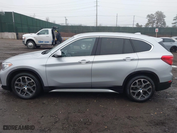 2021 BMW X1 xDrive28i with VIN WBXJG9C04M5T79810, listed as a IAAI auction lot 41471536 with 75,345 mi miles. Bid and sale history available at carsss.com. Image 14.