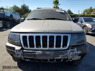 1999 Jeep Grand Cherokee Laredo with VIN 1J4GW58N4XC739465, listed as a Copart auction lot 76130544 with 195,649 mi miles and Salvage Title. Bid and sale history available at carsss.com. Image 5.