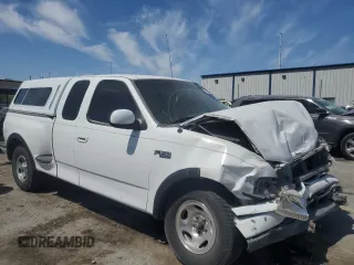 1999 Ford F-150 XL with VIN 1FTZX0726XKA98752, listed as a Copart auction lot 58986695 with Not provided miles and Salvage title. Bid and sale history available at DreamBid. Image 4.