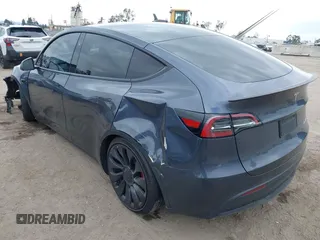 2023 Tesla Model Y Performance z VIN 7SAYGDEF1PF925274, wystawiony jako IAAI lot #42078813 z przebiegiem 20 422 mil mil oraz . Historia ofert i sprzedaży dostępna na DreamBid. Obrazek 3.