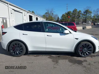 2023 Tesla Model Y Performance with VIN 7SAYGDEF3PF711497, listed as a IAAI auction lot 41877450 with 21,887 mi miles and . Bid and sale history available at DreamBid. Image 13.