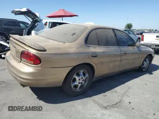 1998 Oldsmobile Intrigue GL z VIN 1G3WS52K1WF373652, wystawiony jako Copart lot #72822084 z przebiegiem 221 028 mil mil oraz Szkoda całkowita • Salvage title. Historia ofert i sprzedaży dostępna na DreamBid. Obrazek 3.