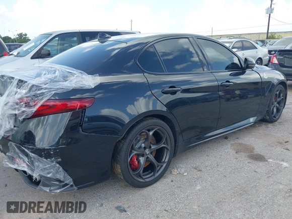 2023 Alfa Romeo Giulia Quadrifoglio with VIN ZARFAMEV9P7674979, listed as a IAAI auction lot 42514383 with 19,226 mi miles and . Bid and sale history available at DreamBid. Image 4.