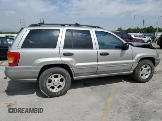 2000 Jeep Grand Cherokee Laredo with VIN 1J4GW48N1YC324356, listed as a Copart auction lot 62011305 with 242,322 mi miles and Salvage title. Bid and sale history available at DreamBid. Image 3.