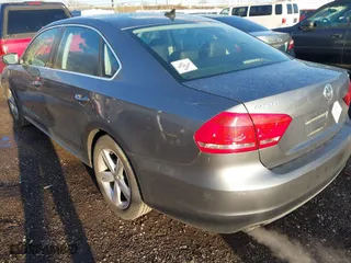 2013 Volkswagen Passat SE with VIN 1VWBP7A33DC025563, listed as a IAAI auction lot 41811324 with 238,800 mi miles. Bid and sale history available at carsss.com. Image 3.