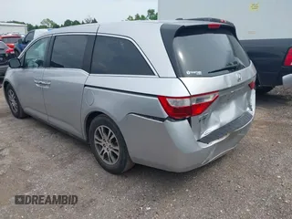 2012 Honda Odyssey EX-L with VIN 5FNRL5H66CB081323, listed as a IAAI auction lot 42465110 with 266,934 mi miles and . Bid and sale history available at DreamBid. Image 3.