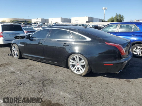 2014 Jaguar XJ with VIN SAJWA2GZXE8V59542, listed as a Copart auction lot 73672614 with 105,328 mi miles and Salvage Title. Bid and sale history available at carsss.com. Image 2.