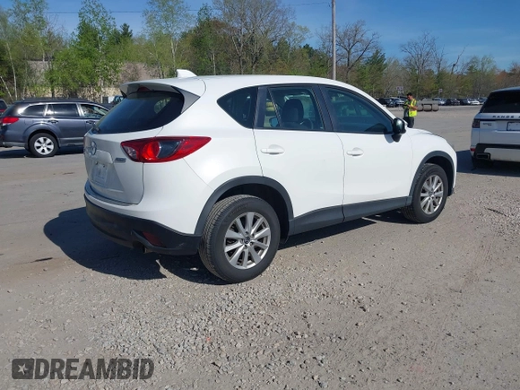 2015 Mazda CX-5 Sport with VIN JM3KE4BY3F0495511, listed as a IAAI auction lot 42170968 with 206,217 mi miles and . Bid and sale history available at carsss.com. Image 4.
