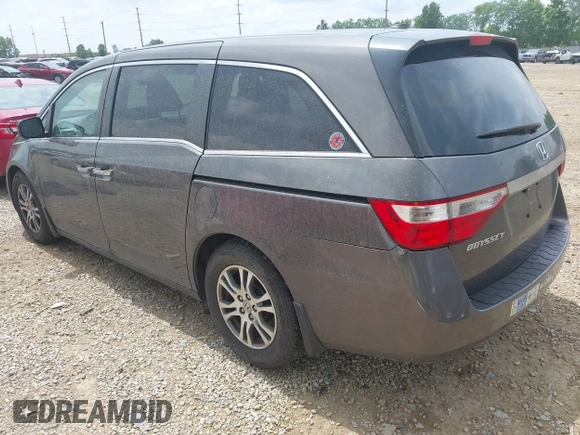 2012 Honda Odyssey EX-L with VIN 5FNRL5H60CB054277, listed as a IAAI auction lot 42459861 with 205,722 mi miles and . Bid and sale history available at DreamBid. Image 3.