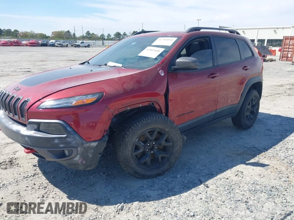 2015 Jeep Cherokee Trailhawk with VIN 1C4PJMBS1FW640483, listed as a IAAI auction lot 41883688 with 103,589 mi miles. Bid and sale history available at carsss.com. Image 17.