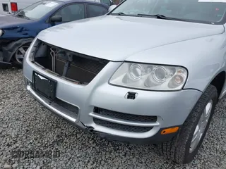 2006 Volkswagen Touareg 4.2L V8 z VIN WVGZM77L06D043948, wystawiony jako IAAI lot #41839431 z przebiegiem 207 496 mil mil oraz . Historia ofert i sprzedaży dostępna na DreamBid. Obrazek 6.